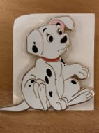 Rolly sitting with one paw up 