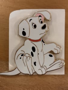 Rolly sitting with one paw up  image