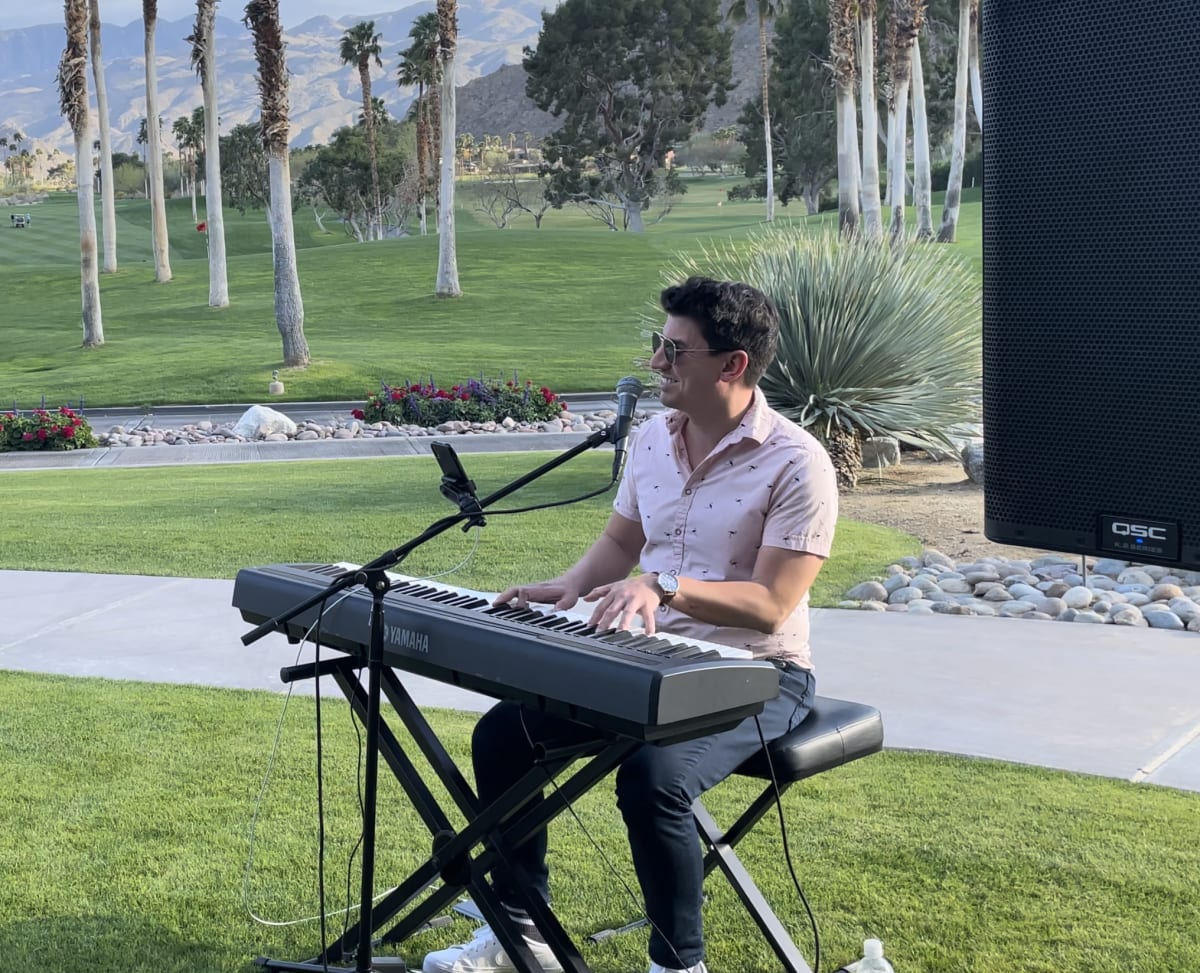 Jay performing at a wedding reception