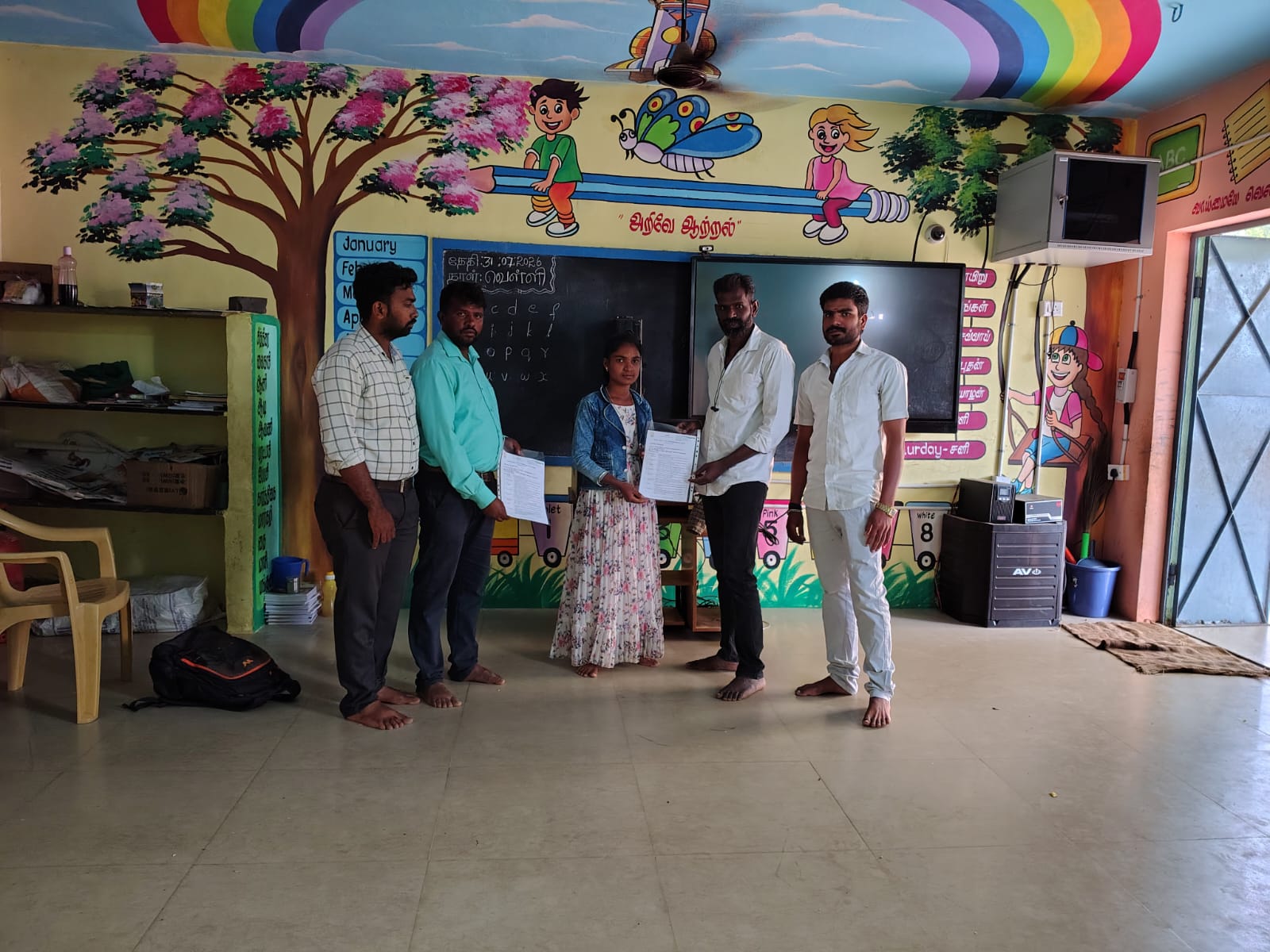 Vazhai team handing appointment letters to new School Companions