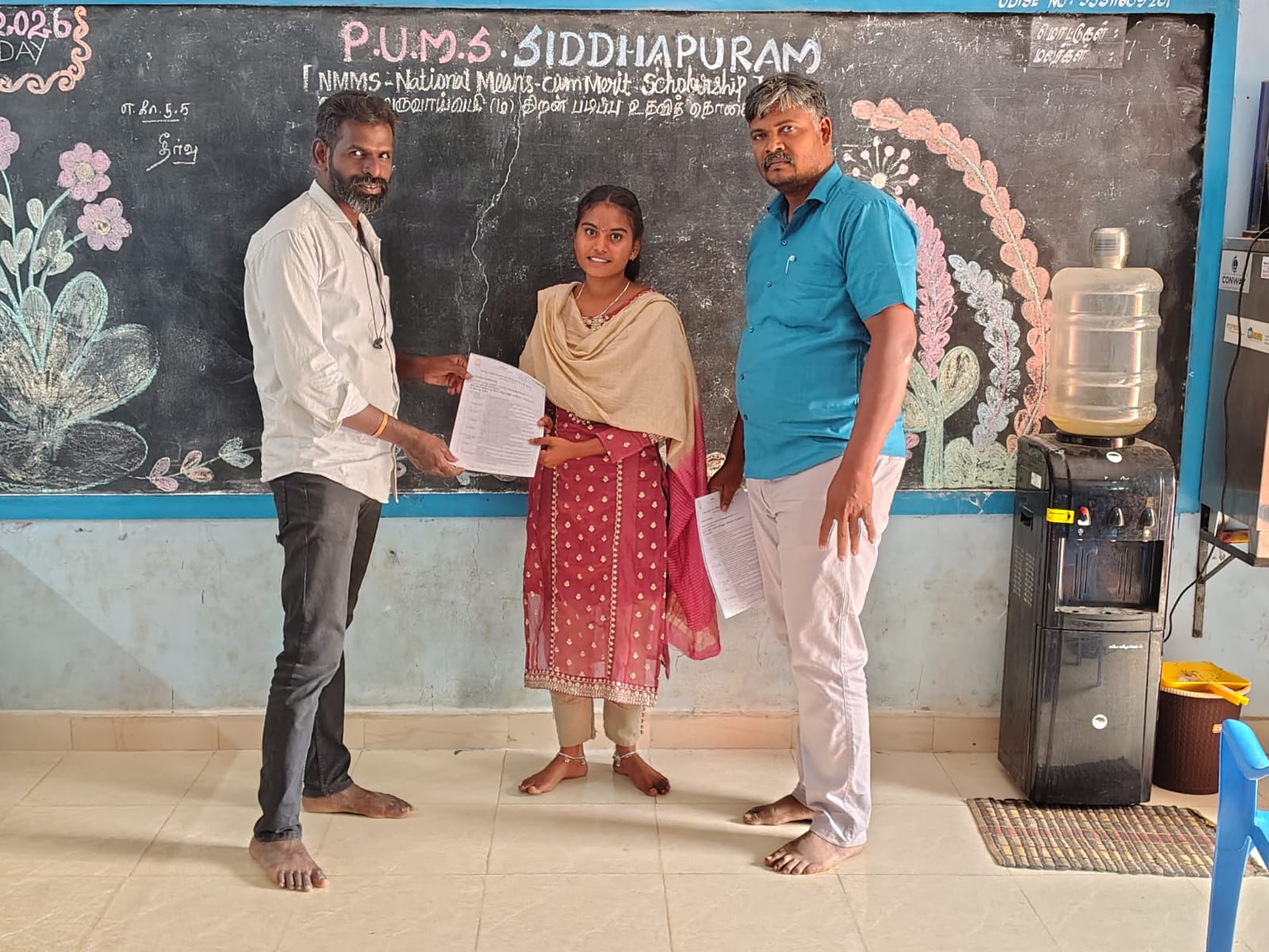 Vazhai team handing appointment letters to new School Companions