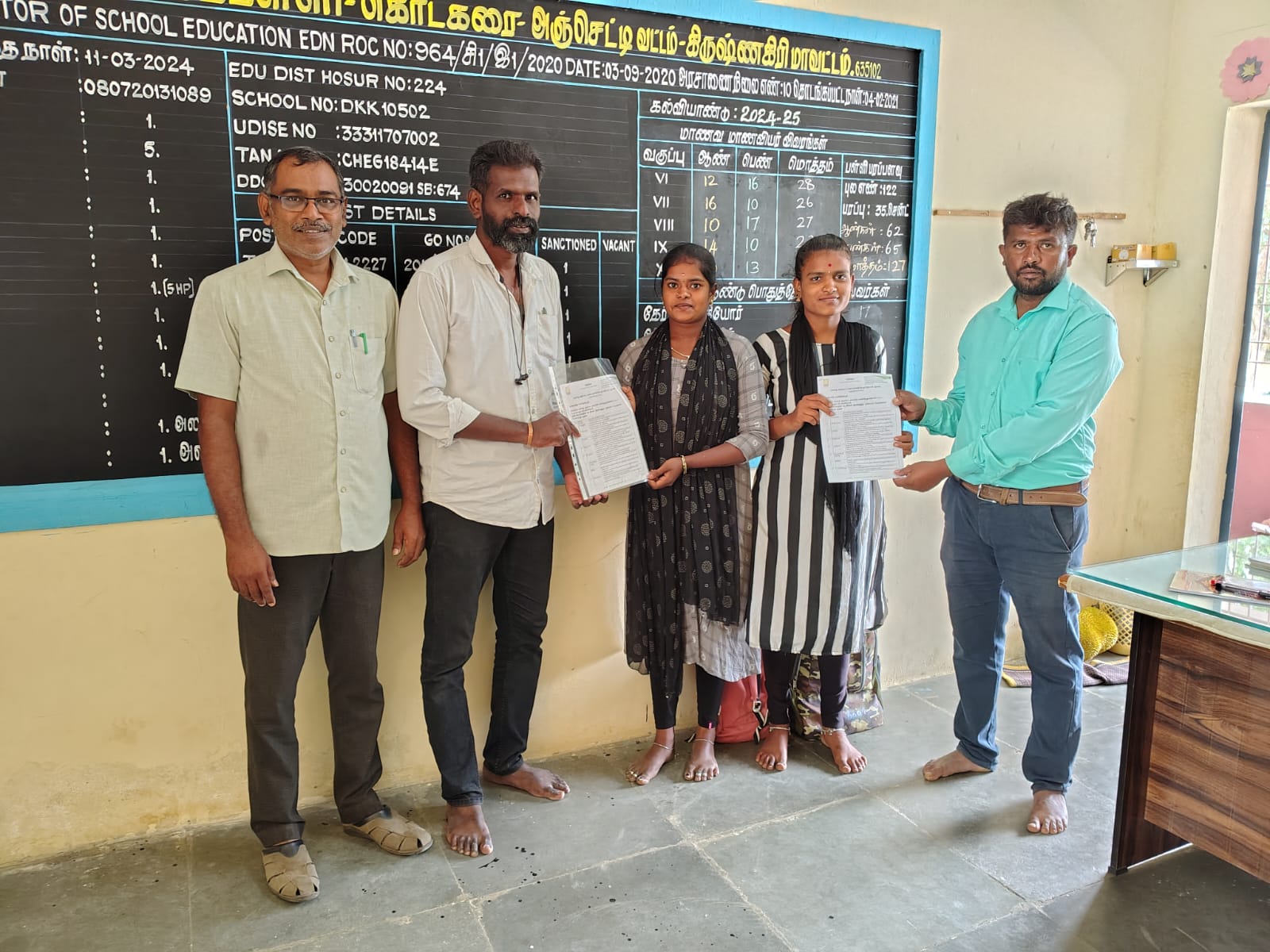 Vazhai field coordinator handing appointment letters to new School Companions