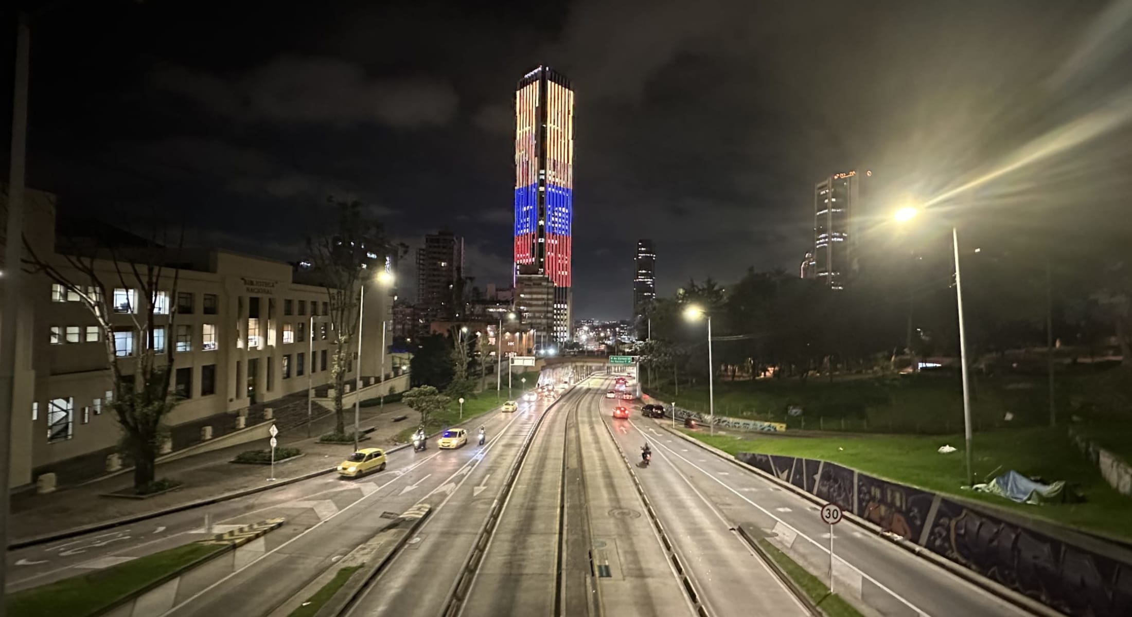 Night view of modern Bogotá with illuminated buildings and traffic