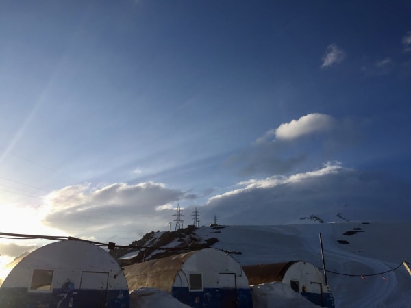 Barrel-shaped shelter huts on snow-covered terrain, Mount Elbrus Expedition