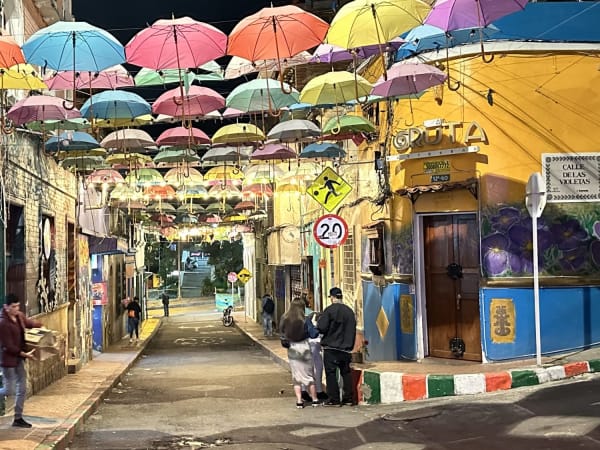 Colorful umbrella street installation in La Candelaria Bogotá