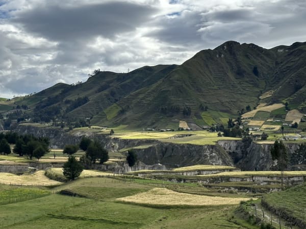 Agricultural terraces on green hills near Quilotoa in Ecuador
