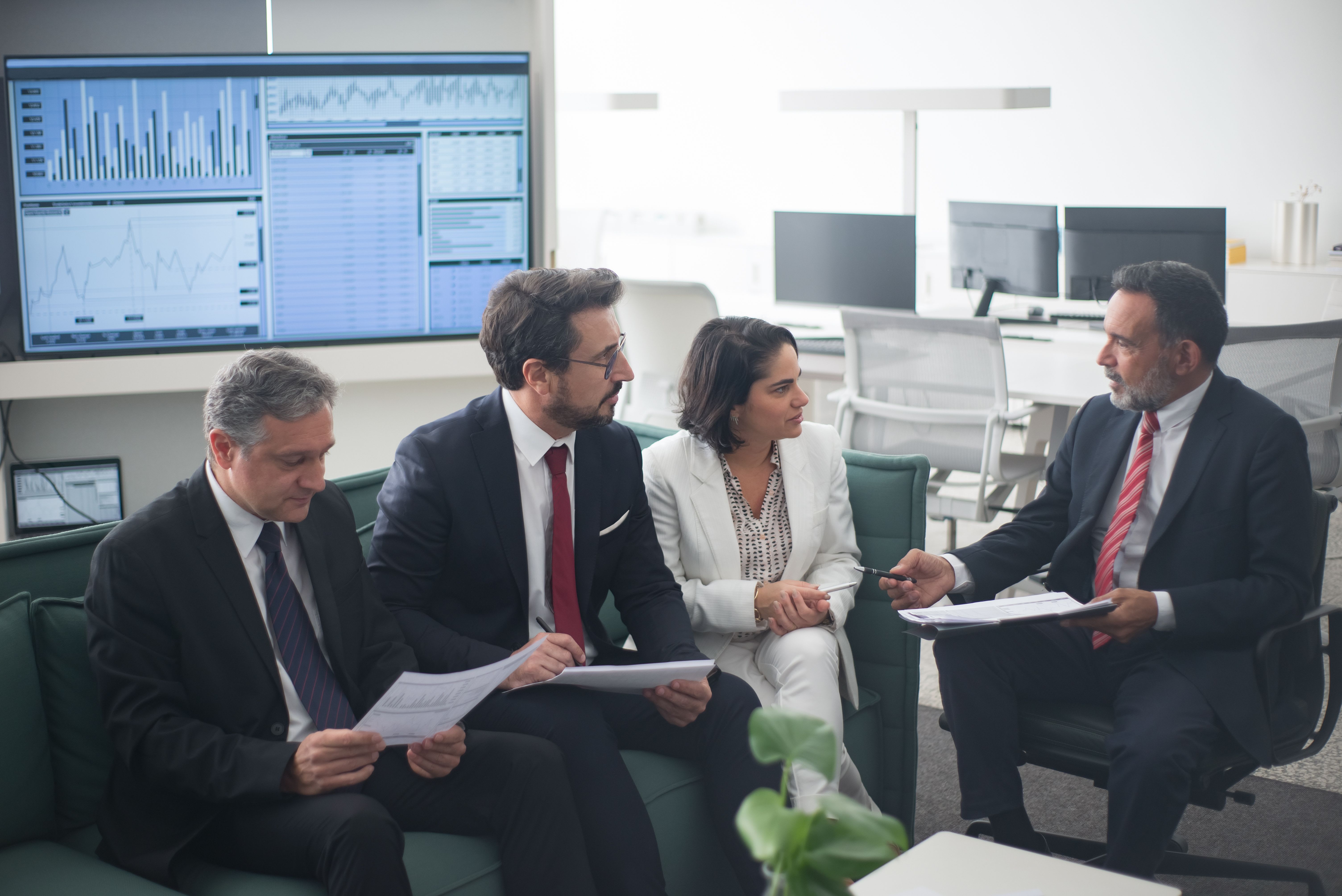 Professionals reviewing financial strategies