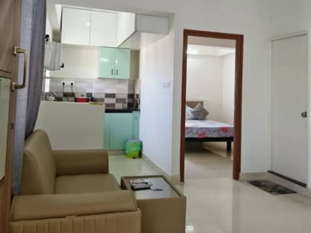 Spacious 1 BHK fully furnished apartment in Whitefield — living area and home amenities