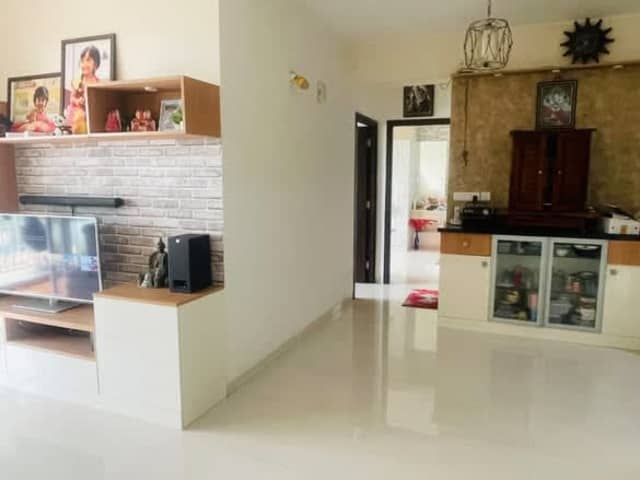 Semi-furnished 2BHK on Sarjapur Road — living area and home amenities