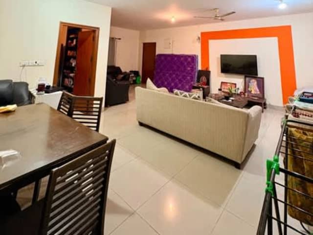 Master bedroom in 3BHK Flat for female roommate — living area and home amenities