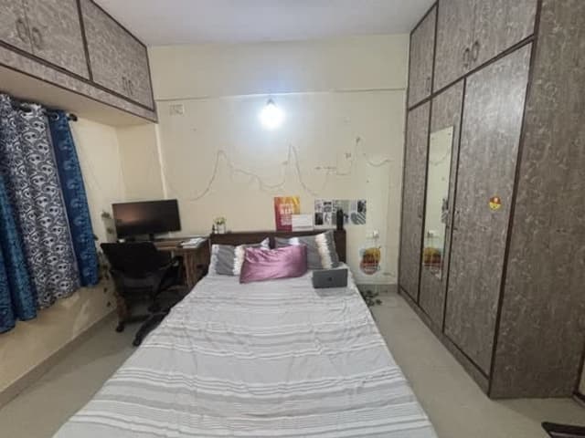 Room Available in Semi-Furnished 2BHK — Green Glen Layout — living area and home amenities