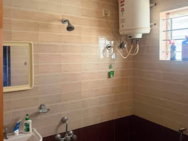 Furnished Room in 3BHK Apartment in JP Nagar Phase 7 — living area and home amenities