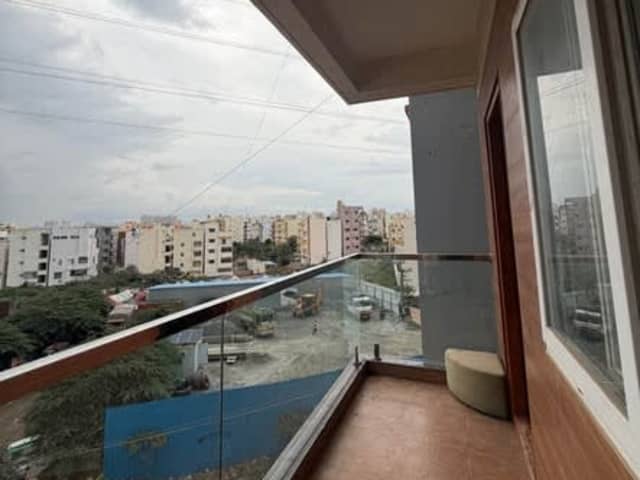 1 Room Available in a 2BHK apartment — living area and home amenities