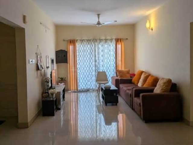 Female Flatmate Replacement Needed in 3BHK — living area and home amenities