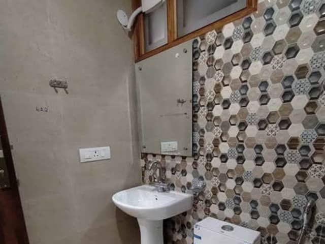 Fully Furnished RK in Sector 57, Gurgaon — living area and home amenities