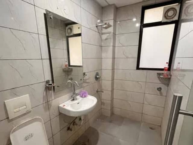 1RK in Sushant Lok C Block — living area and home amenities