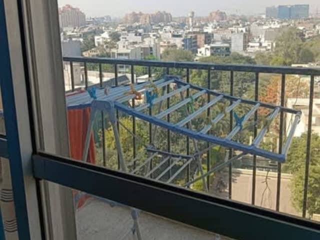 One room in 3BHK flat in DLF Oakwood Estate — living area and home amenities