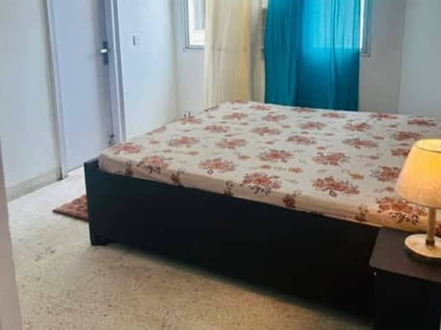 Beautiful 2BHK in Society — living area and home amenities