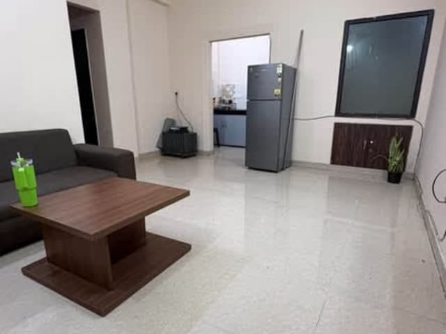 Fully Furnished 2BHK in Sector 15 Part 1 — living area and home amenities