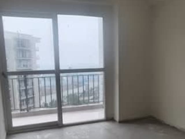 2BHK raw flat in Conscient Habitat 102 Gurugram — living area and home amenities