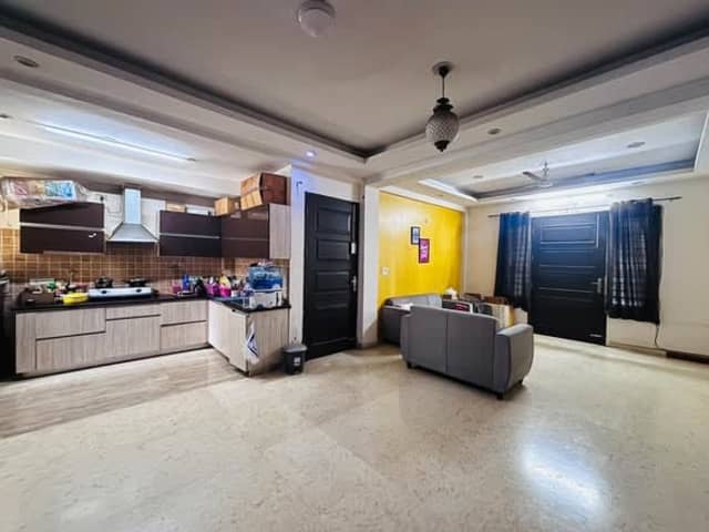 Female Flatmate in Semi-furnished 4BHK flat — living area and home amenities