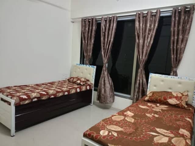 Boys PG in Andheri East, Mumbai — living area and home amenities