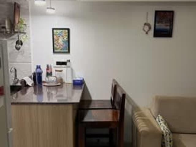 Double Sharing 1BHK in Kalina — living area and home amenities