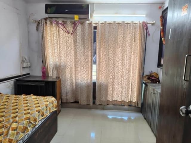 Fully Furnished Room Available for Rent – Oshiwara, Andheri West, Mumbai — living area and home amenities