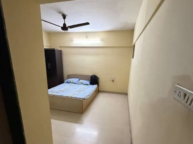 Cozy 3BHK Room for Male Flatmate in Kharadi — living area and home amenities