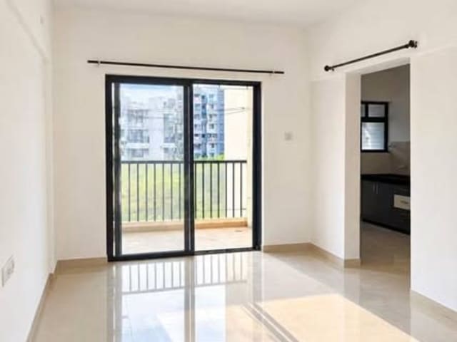 Spacious 2BHK Flat for Rent – Kolte IVY Estate Umang Premier Wagholi — living area and home amenities