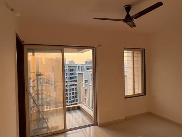 2 BHK Semi-Furnished Flat for Rent in Wakad — living area and home amenities