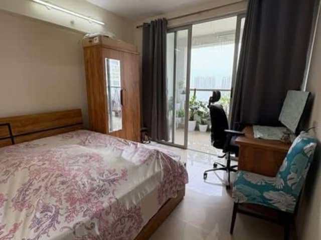Spacious Room in Amanora Future Towers — living area and home amenities