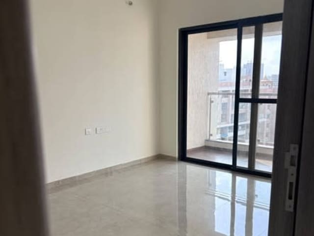 2 BHK Semi-Furnished Flat in Wakad — living area and home amenities
