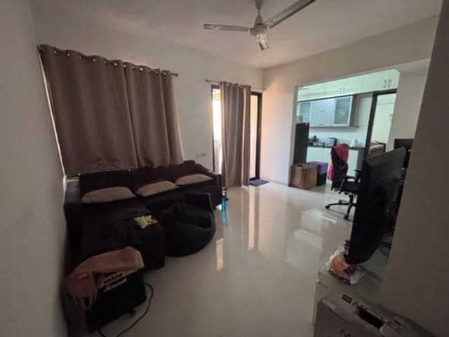 Fully Furnished 1 BHK for Rent in Oxy Ultima, Wagholi — living area and home amenities