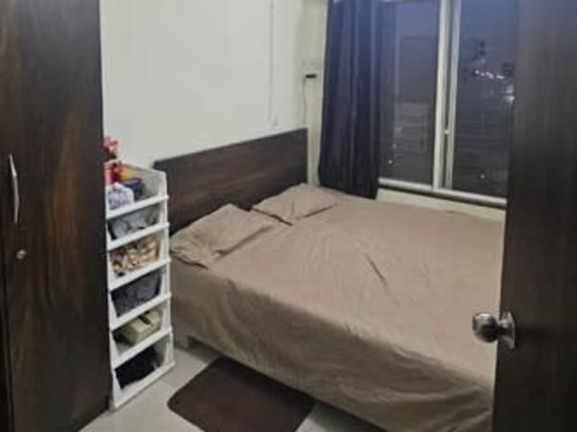 Private room in 3BHK Brahma Sky City, Dhanori — living area and home amenities