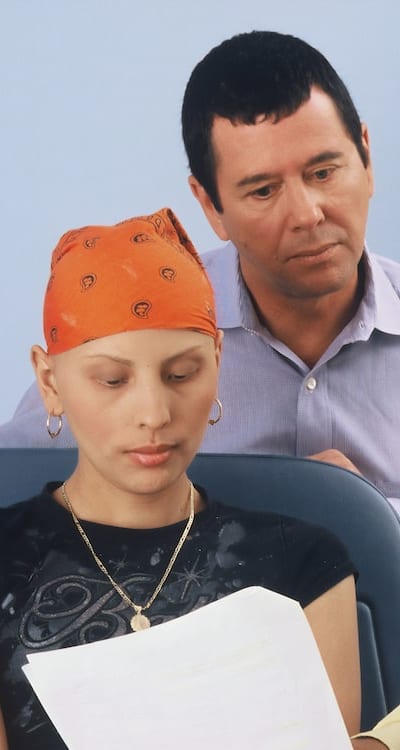 Assessing the condition of a vine before pruning.