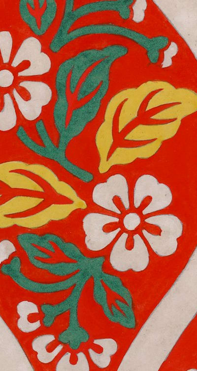 A gardener planting summer flowering bulbs in the soil.