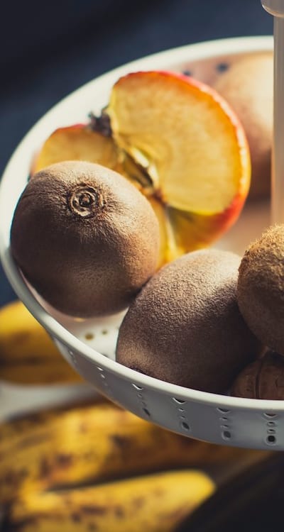 Harvested passion fruits turning vibrant purple or orange.