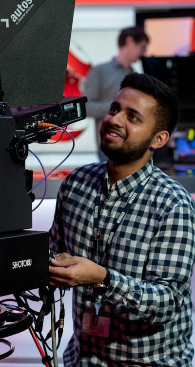 A person using gardening tools in a garden