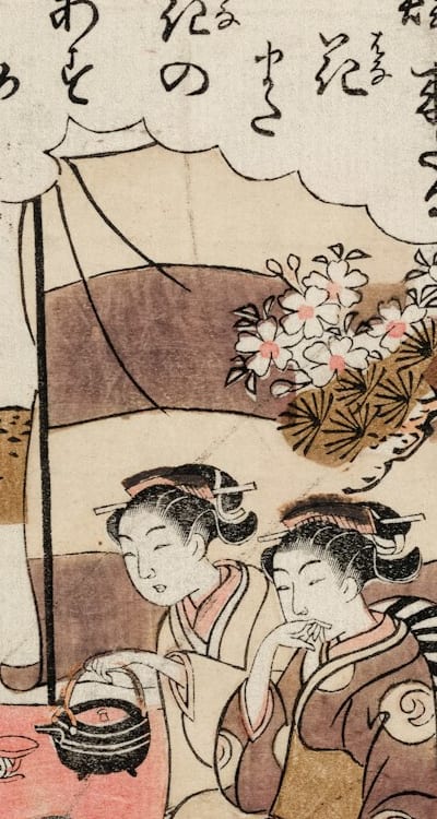 A woman planting flower seeds in a garden.