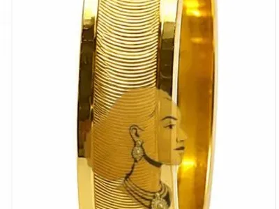 A beautifully handcrafted 21K gold wedding ring featuring an elegant polished finish and timeless design. Perfect for weddings, engagements, anniversaries, or everyday wear.