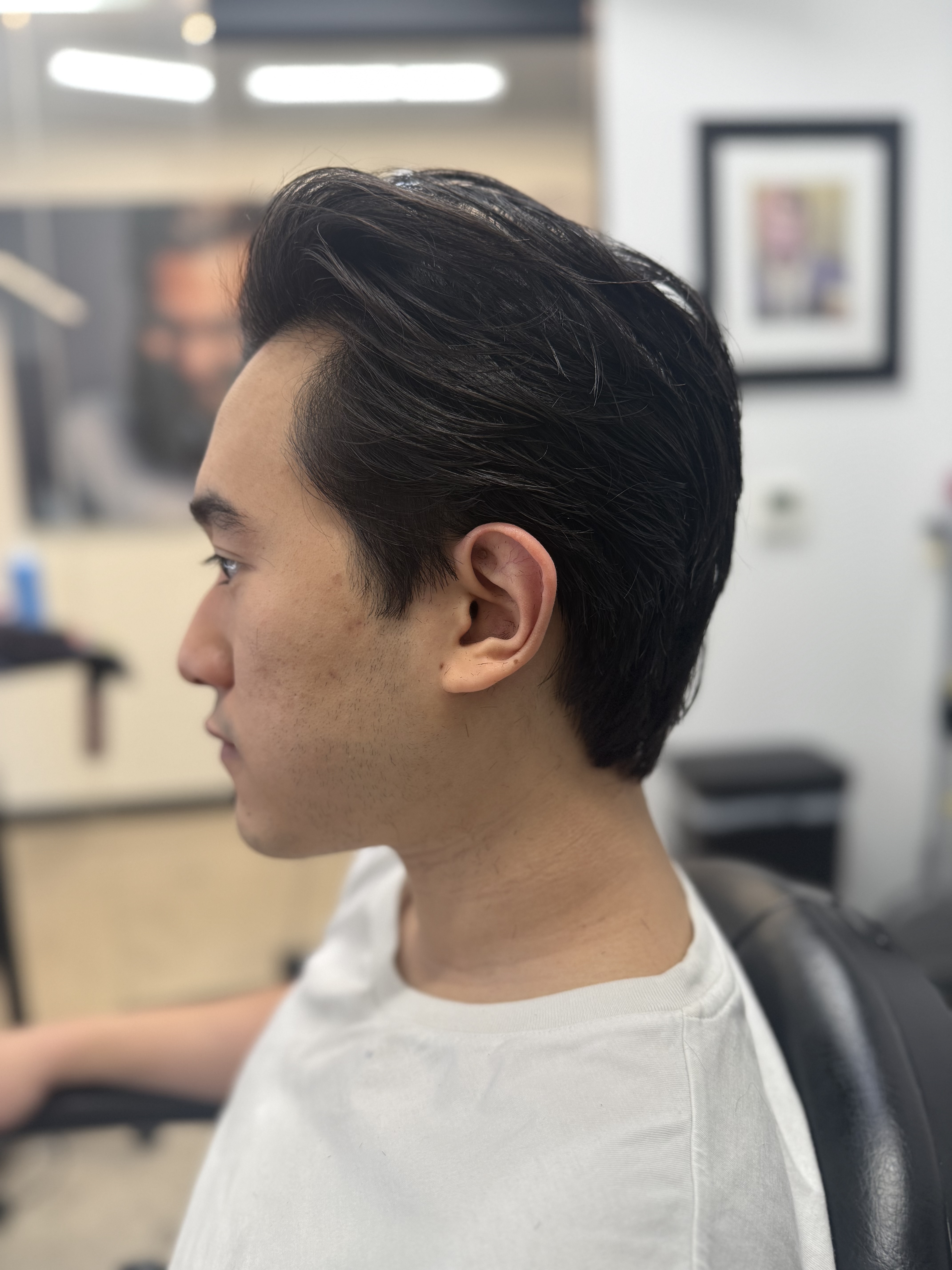 Medium length men's haircut sweep Austin