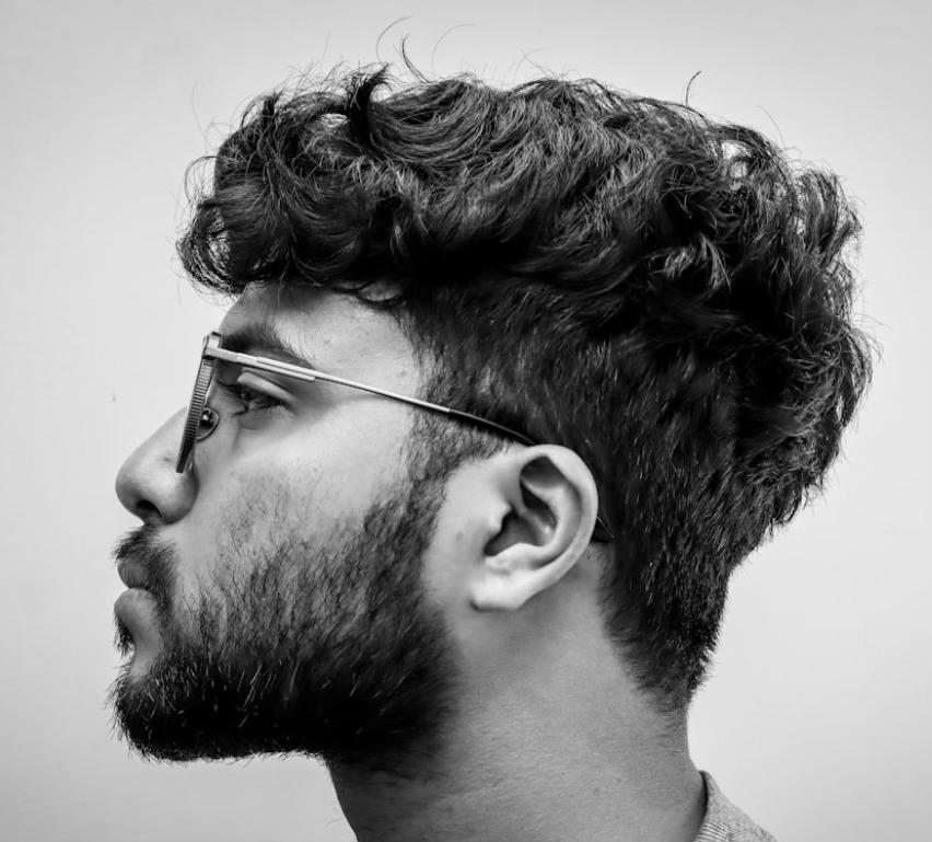 Men's voluminous curl texture, side profile