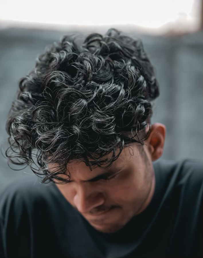 Men's curl texture, close crop
