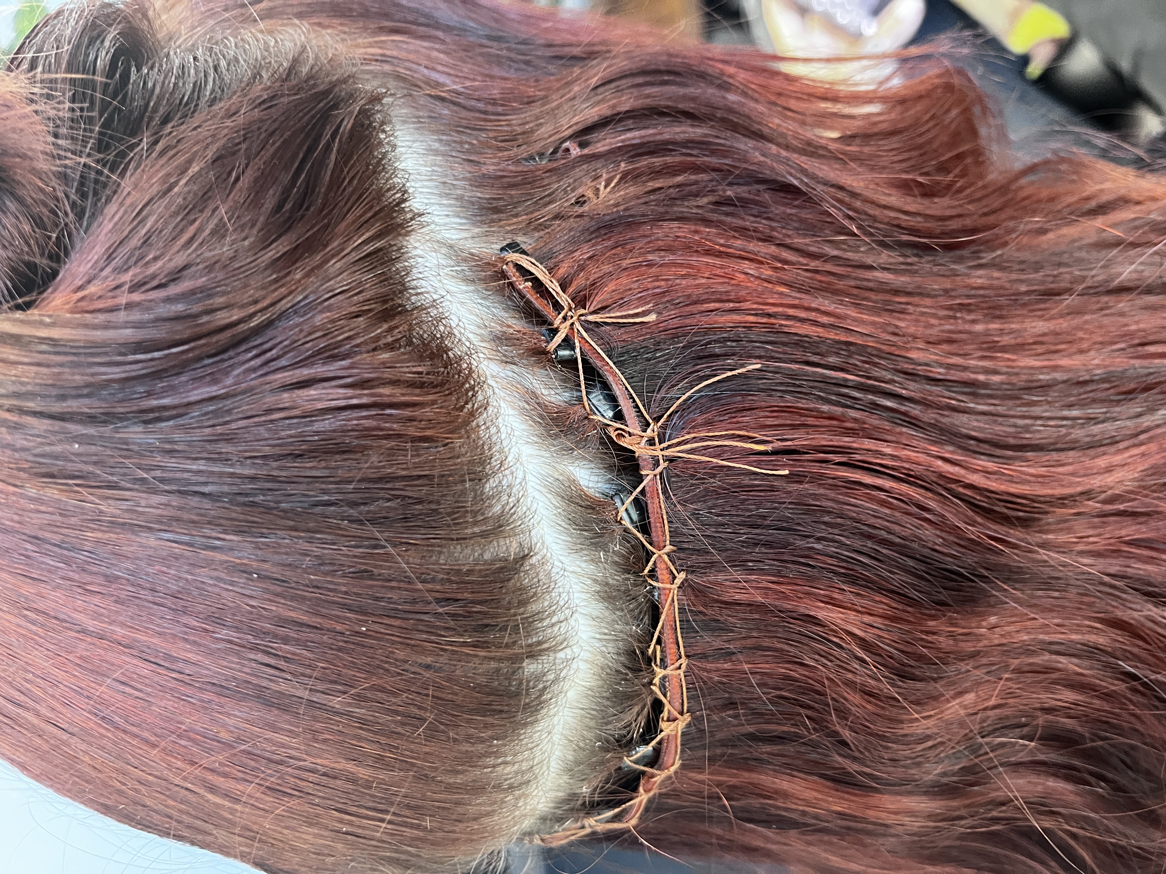 Failed beaded weft installation before removal, side detail