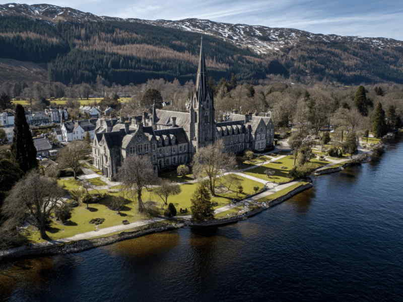 Scenic aerial view of Fort Augustus on the shores of Loch Ness, with the historic abbey, village houses.