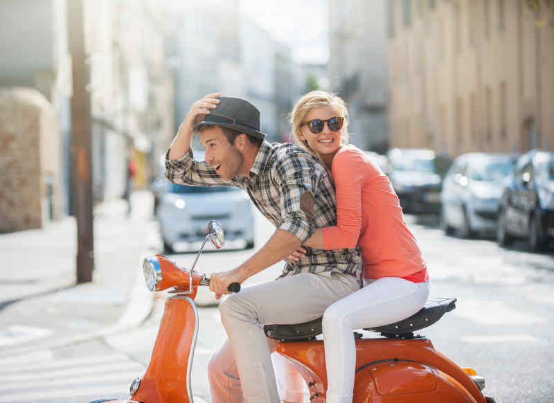 Riding a Vespa in Italy