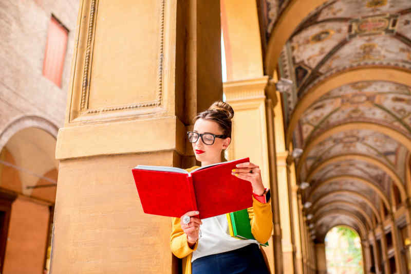 Italian woman reading in Bologna