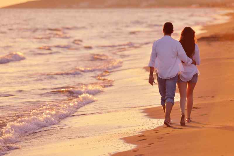 Couple walking on beach