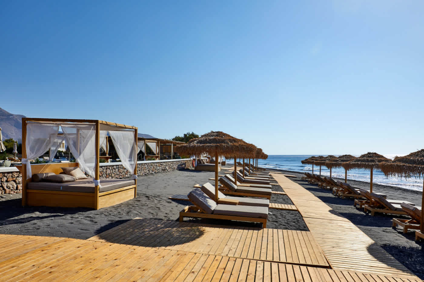 Black sand beach at Sea Breeze Luxury Resort Santorini